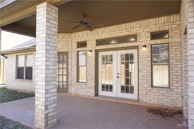 doorway to property with french doors, a patio, and ceiling fan