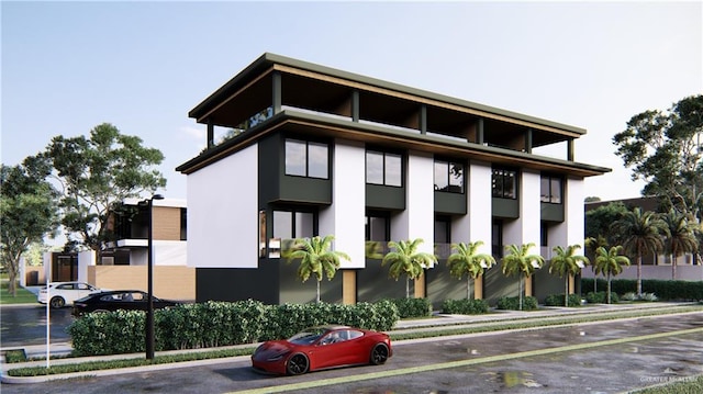 view of building exterior with uncovered parking