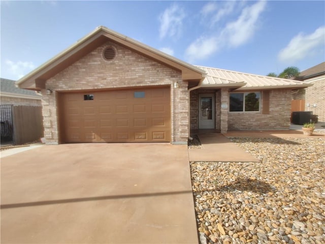 ranch-style home with cooling unit and a garage