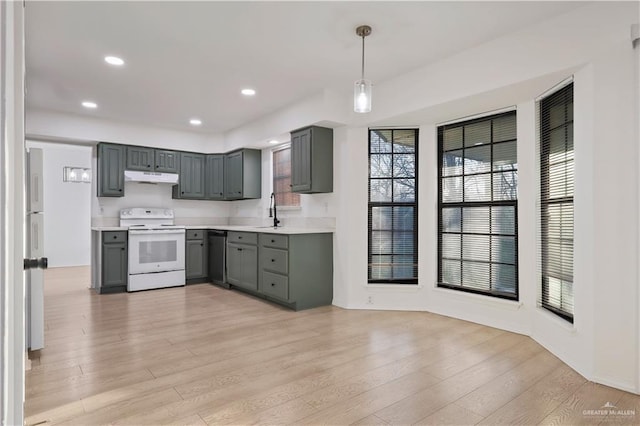 kitchen with electric range, gray cabinetry, under cabinet range hood, light countertops, and dishwasher