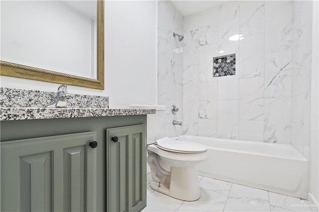 bathroom with marble finish floor, vanity, toilet, and shower / bathtub combination