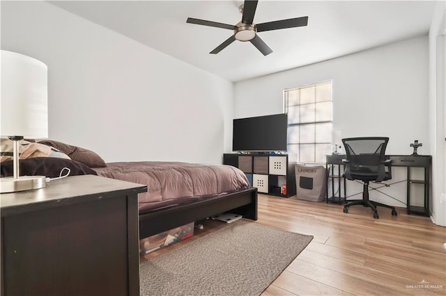 bedroom featuring a ceiling fan and light wood-style floors