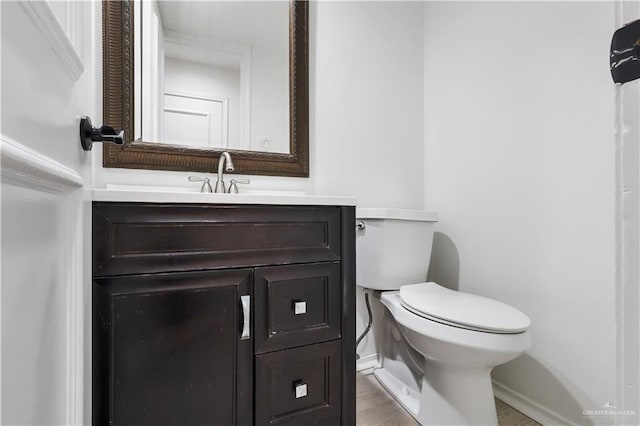 bathroom with toilet and vanity