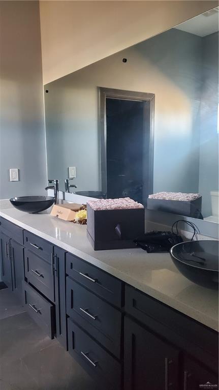 bathroom featuring tile patterned floors and vanity