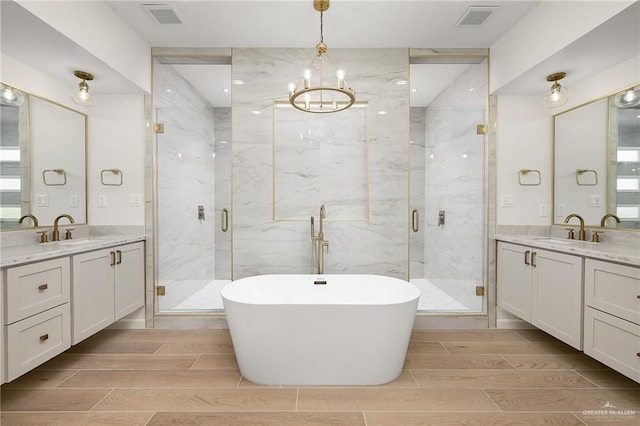 1003 Bette St, Pharr, TX 78577 - bathroom featuring visible vents, a sink, and a marble finish shower