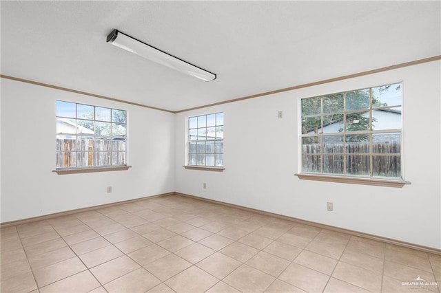 tiled empty room with crown molding