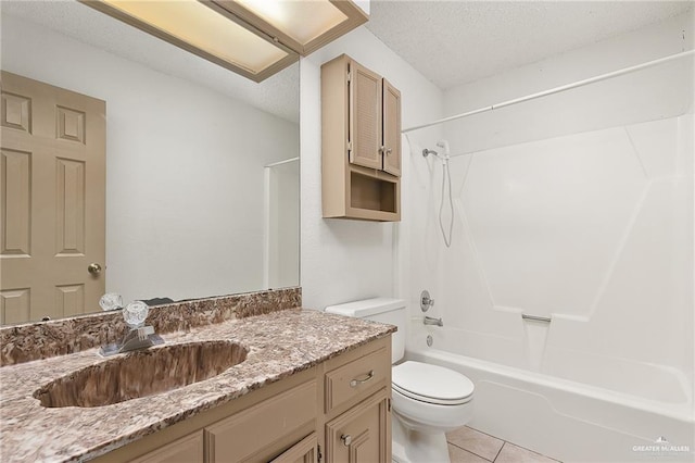 full bathroom with shower / washtub combination, vanity, a textured ceiling, tile patterned floors, and toilet