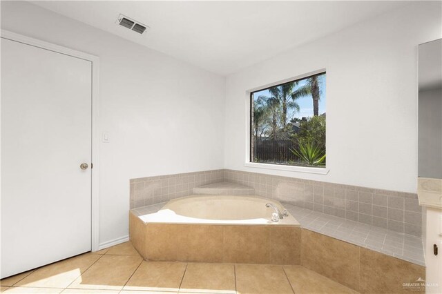 full bath with a garden tub, tile patterned flooring, and visible vents