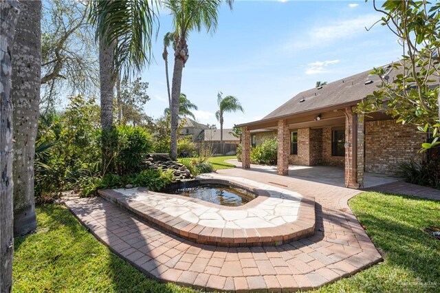 view of pool featuring a patio, a yard, and fence