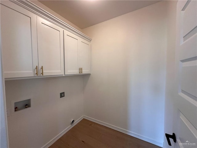 laundry room with electric dryer hookup, cabinets, dark hardwood / wood-style floors, and washer hookup