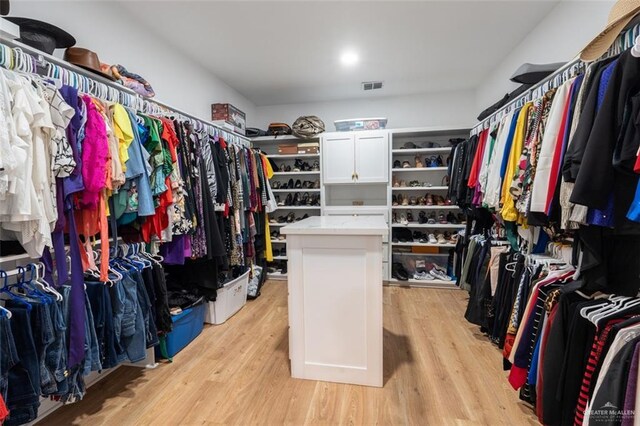 spacious closet featuring light wood-style floors and visible vents