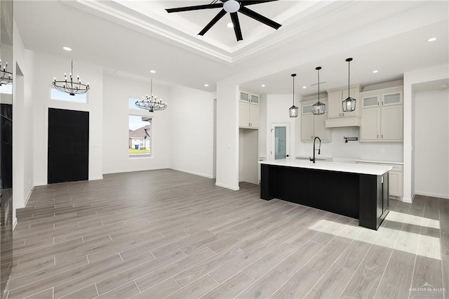904 N Trinity St, Edinburg, TX 78541 - kitchen with a chandelier, light countertops, recessed lighting, light wood finished floors, and a large island
