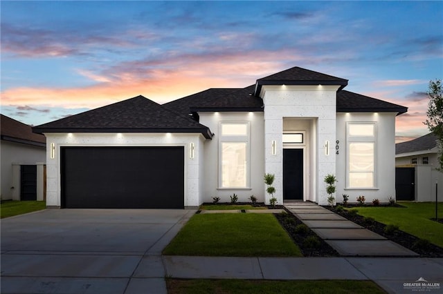 904 N Trinity St, Edinburg, TX 78541 - view of front of home with roof with shingles, a garage, a front lawn, and driveway