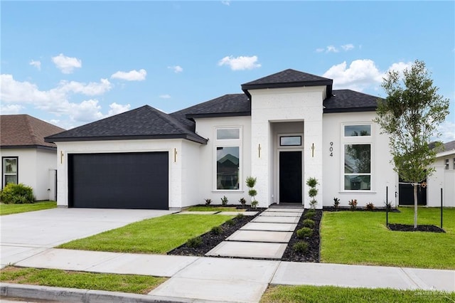 904 N Trinity St, Edinburg, TX 78541 - view of front of house with an attached garage, a front lawn, a shingled roof, concrete driveway, and stucco siding