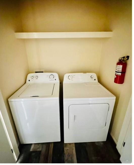 washroom featuring dark hardwood / wood-style floors and independent washer and dryer