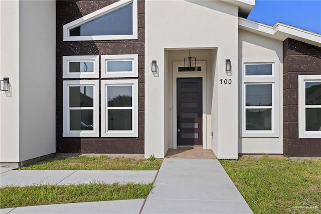 700 Juan Seguin St, Weslaco, TX 78599 - view of exterior entry featuring stucco siding