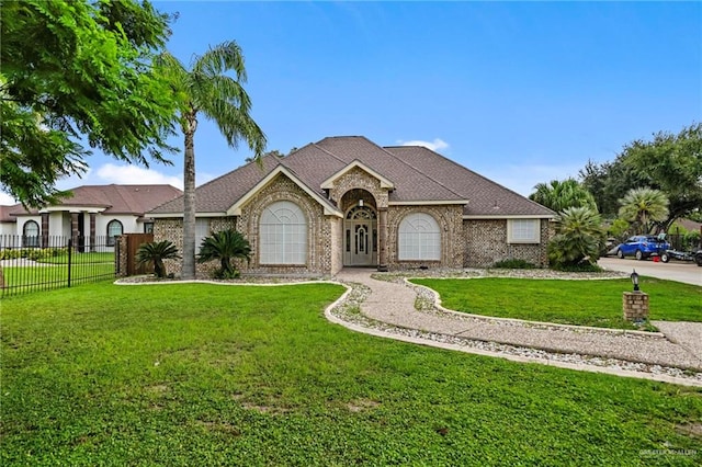 ranch-style house with a front lawn