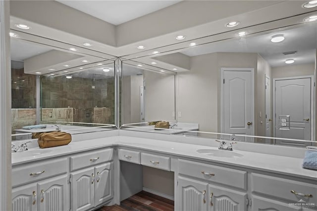 bathroom featuring hardwood / wood-style flooring and vanity