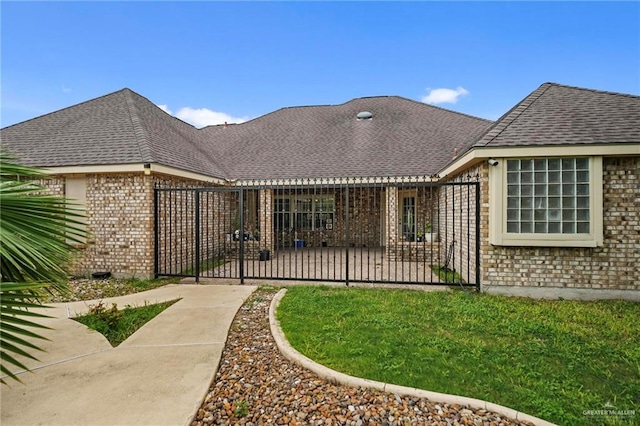 back of property featuring a yard and a patio area