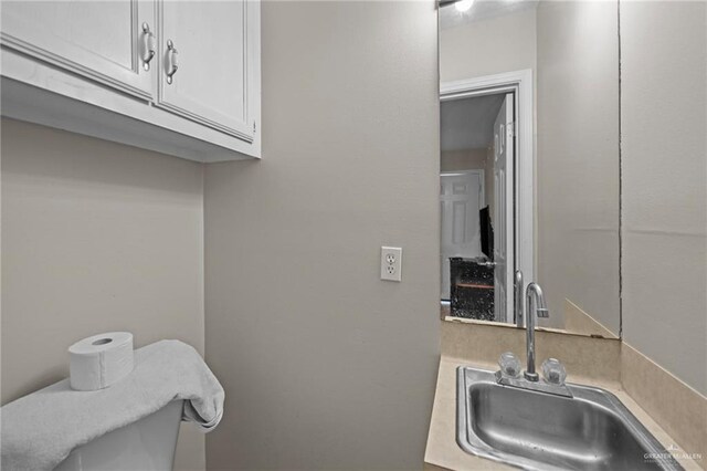 kitchen with white cabinets and sink