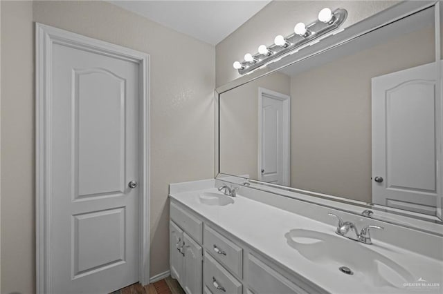 bathroom featuring hardwood / wood-style flooring and vanity