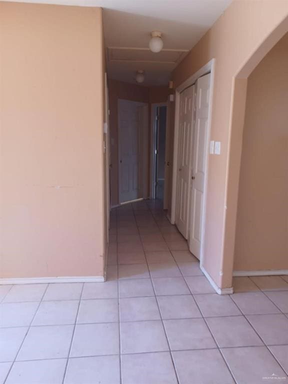 hallway featuring light tile patterned floors