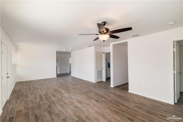 empty room featuring ceiling fan and dark hardwood / wood-style floors