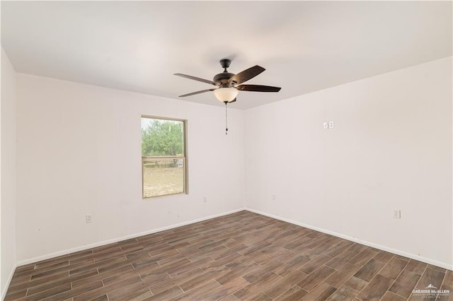 spare room with ceiling fan and dark hardwood / wood-style flooring