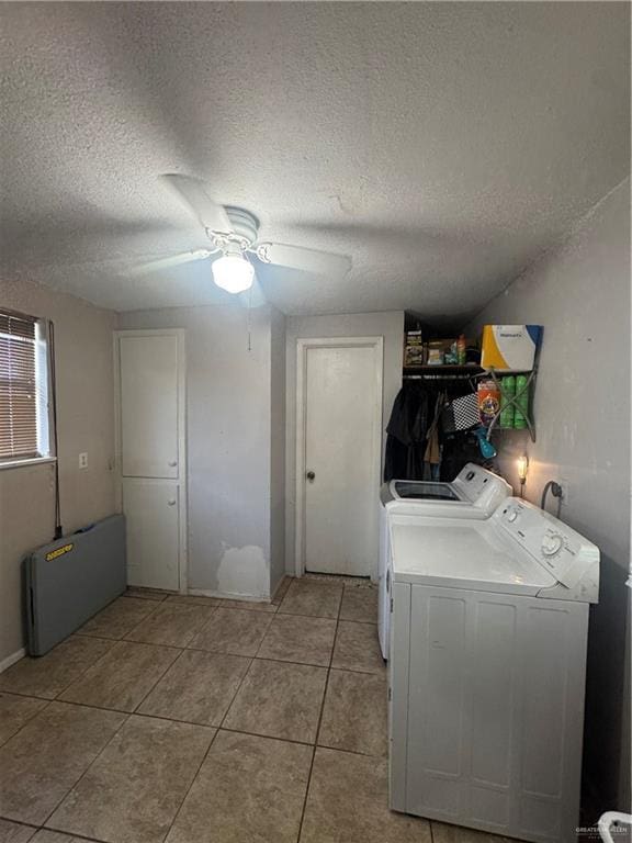 1008 S 3rd St, Edinburg, TX 78539 - laundry area featuring washer and clothes dryer, a textured ceiling, a ceiling fan, light tile patterned floors, and radiator
