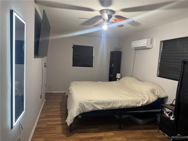 1008 S 3rd St, Edinburg, TX 78539 - bedroom with a wall mounted AC, wood finished floors, and a ceiling fan