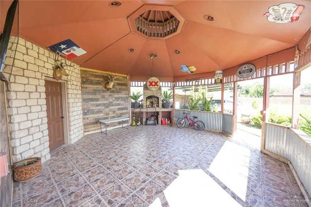 view of patio featuring an outdoor stone fireplace