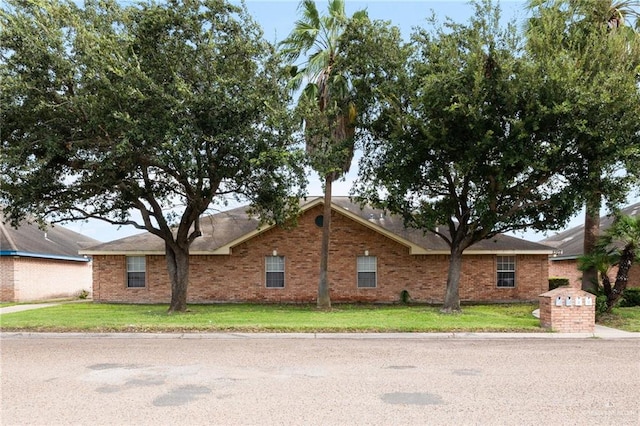 ranch-style home with a front yard