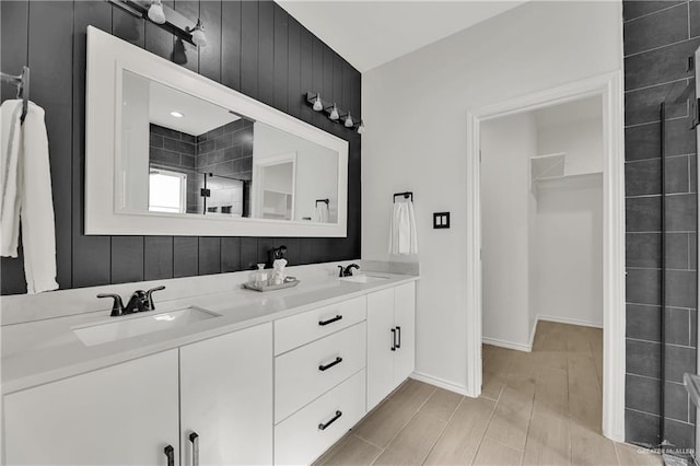 2208 Providence Ave, Mcallen, TX 78504 - bathroom featuring double vanity and a tile shower