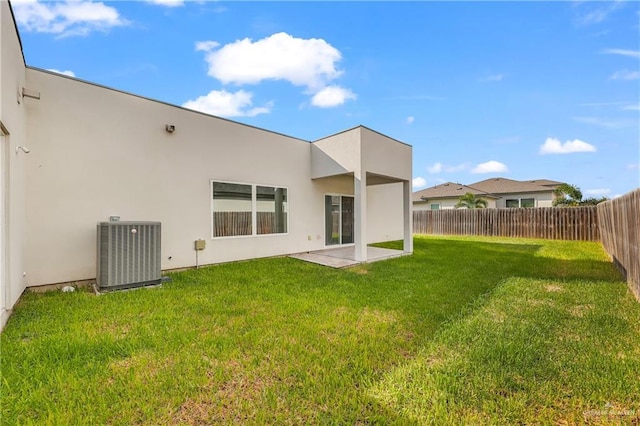 2208 Providence Ave, Mcallen, TX 78504 - back of property with a fenced backyard, stucco siding, and a patio area