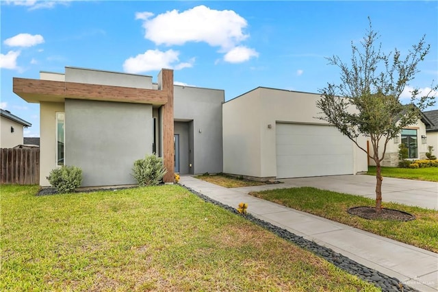 2208 Providence Ave, Mcallen, TX 78504 - modern home with an attached garage, driveway, and stucco siding