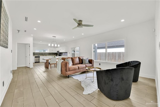 2208 Providence Ave, Mcallen, TX 78504 - living room featuring a ceiling fan, light wood-style floors, recessed lighting, and a chandelier