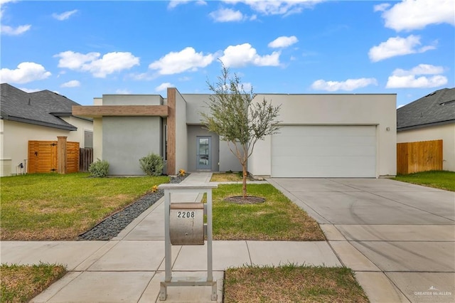 2208 Providence Ave, Mcallen, TX 78504 - view of front of property featuring an attached garage, concrete driveway, and stucco siding