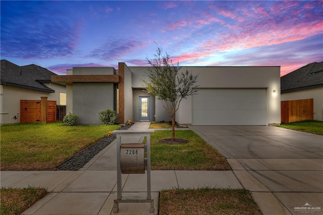 2208 Providence Ave, Mcallen, TX 78504 - view of front facade with a garage, driveway, and stucco siding