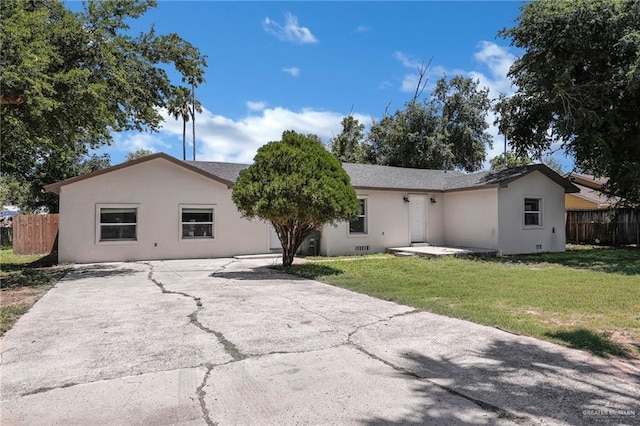 209 E 11th St, San Juan, TX 78589 - back of house with driveway and stucco siding