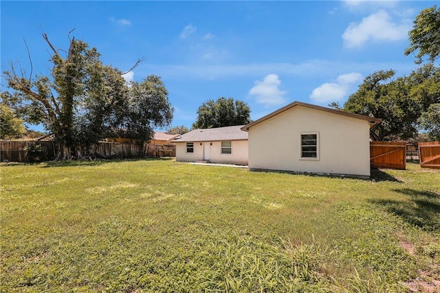 209 E 11th St, San Juan, TX 78589 - rear view of property with stucco siding