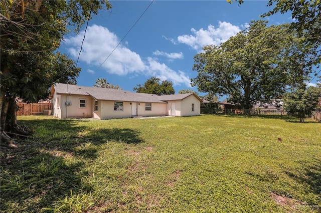 209 E 11th St, San Juan, TX 78589 - back of property featuring stucco siding