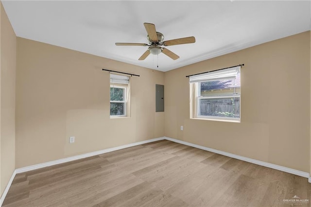 209 E 11th St, San Juan, TX 78589 - unfurnished room with light wood-type flooring, baseboards, ceiling fan, and electric panel