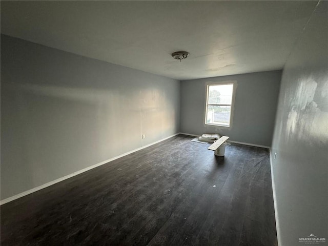 unfurnished room featuring dark hardwood / wood-style floors