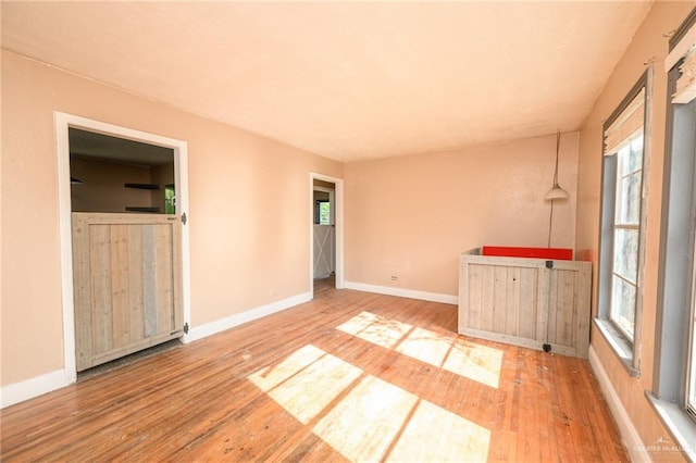408 E Ebony St, La Feria, TX 78559 - spare room featuring hardwood / wood-style floors
