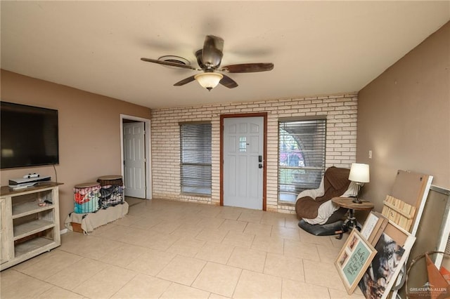 408 E Ebony St, La Feria, TX 78559 - living area with brick wall and ceiling fan