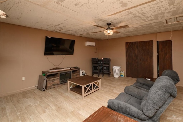 408 E Ebony St, La Feria, TX 78559 - living area with ceiling fan, light wood-type flooring, and an AC wall unit