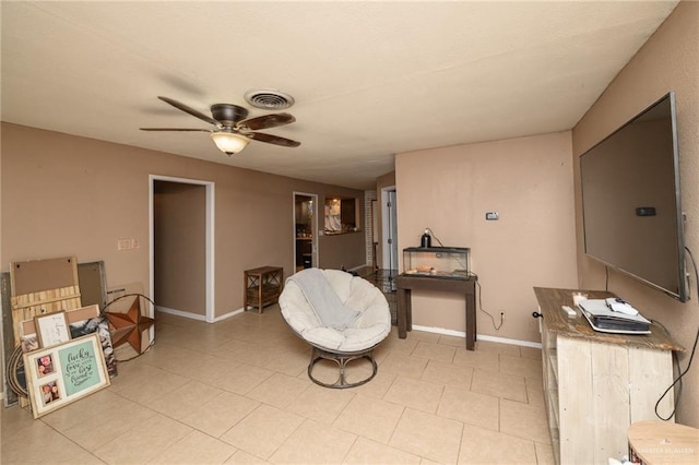 408 E Ebony St, La Feria, TX 78559 - sitting room featuring ceiling fan and light tile patterned floors