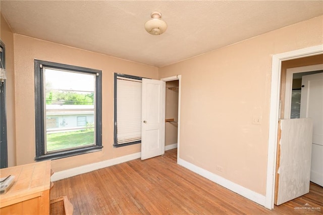 408 E Ebony St, La Feria, TX 78559 - unfurnished bedroom featuring light wood-type flooring and a closet