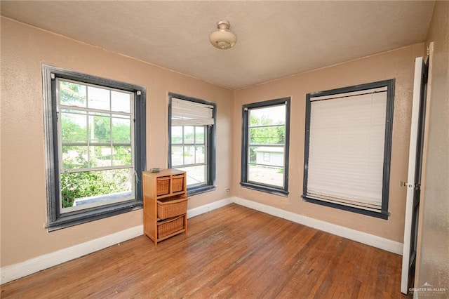 408 E Ebony St, La Feria, TX 78559 - empty room featuring wood finished floors and baseboards
