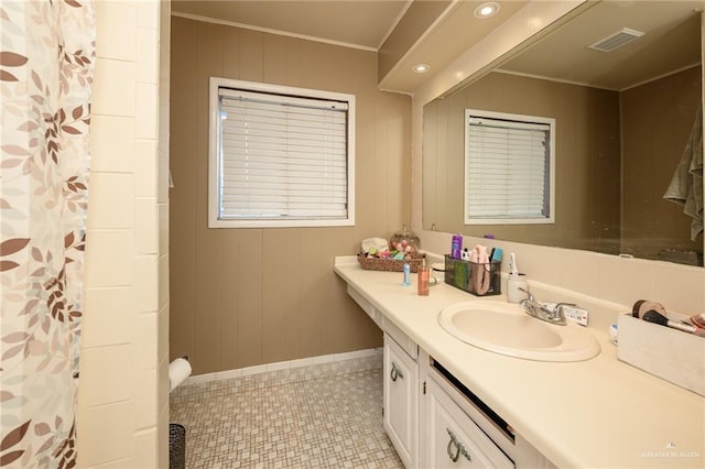 408 E Ebony St, La Feria, TX 78559 - bathroom with vanity, ornamental molding, and a shower with curtain